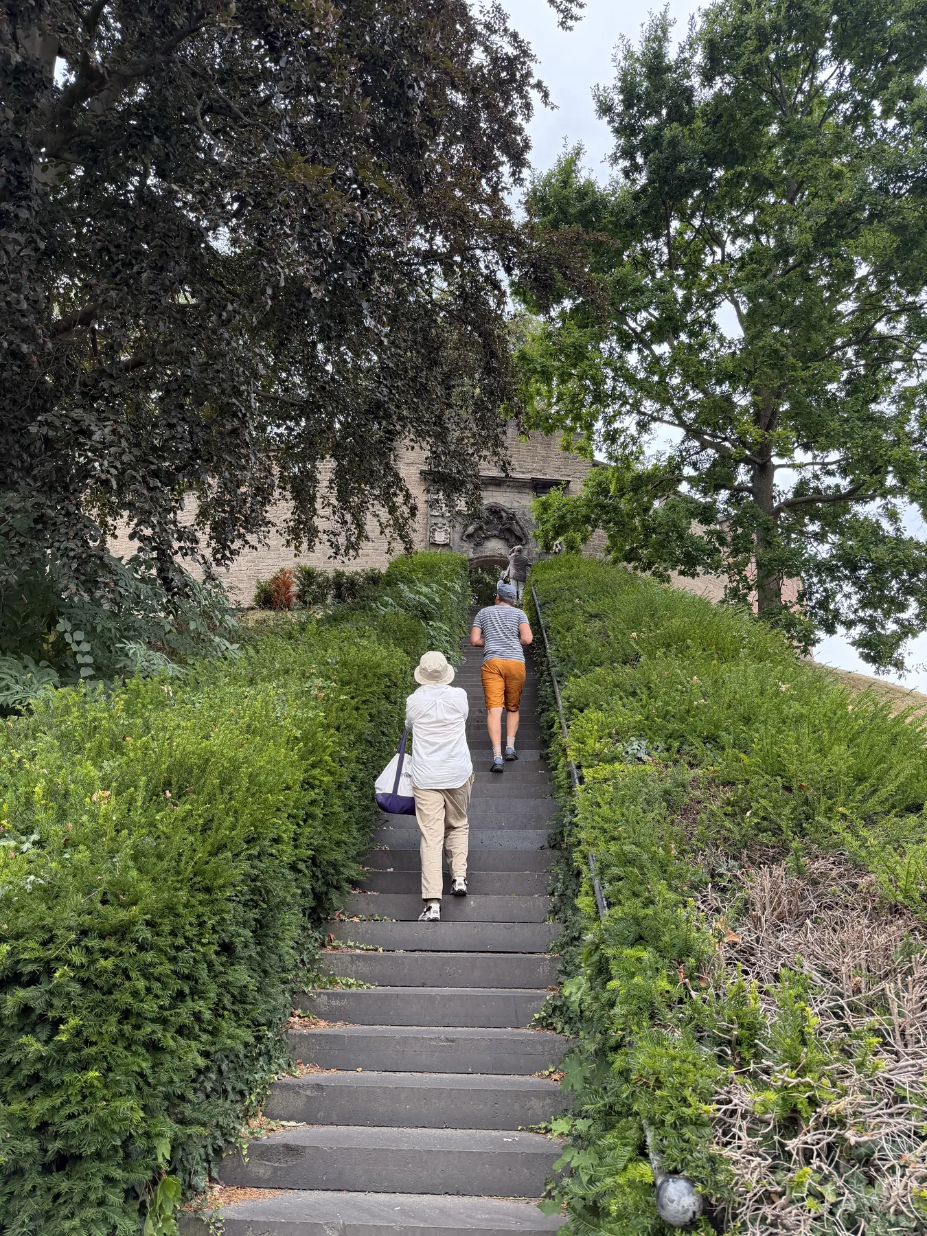 Visitors climbing the stairs to the gate of De Burcht in Leiden