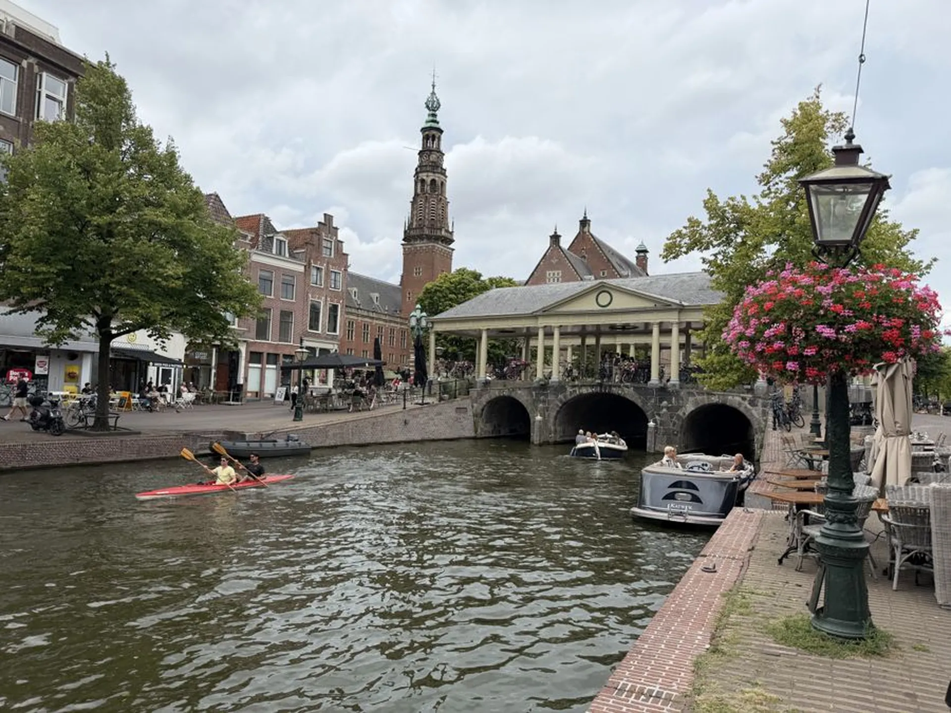 Terraces and historic houses along the Nieuwe Rijn at the Koornbrug in Leiden
