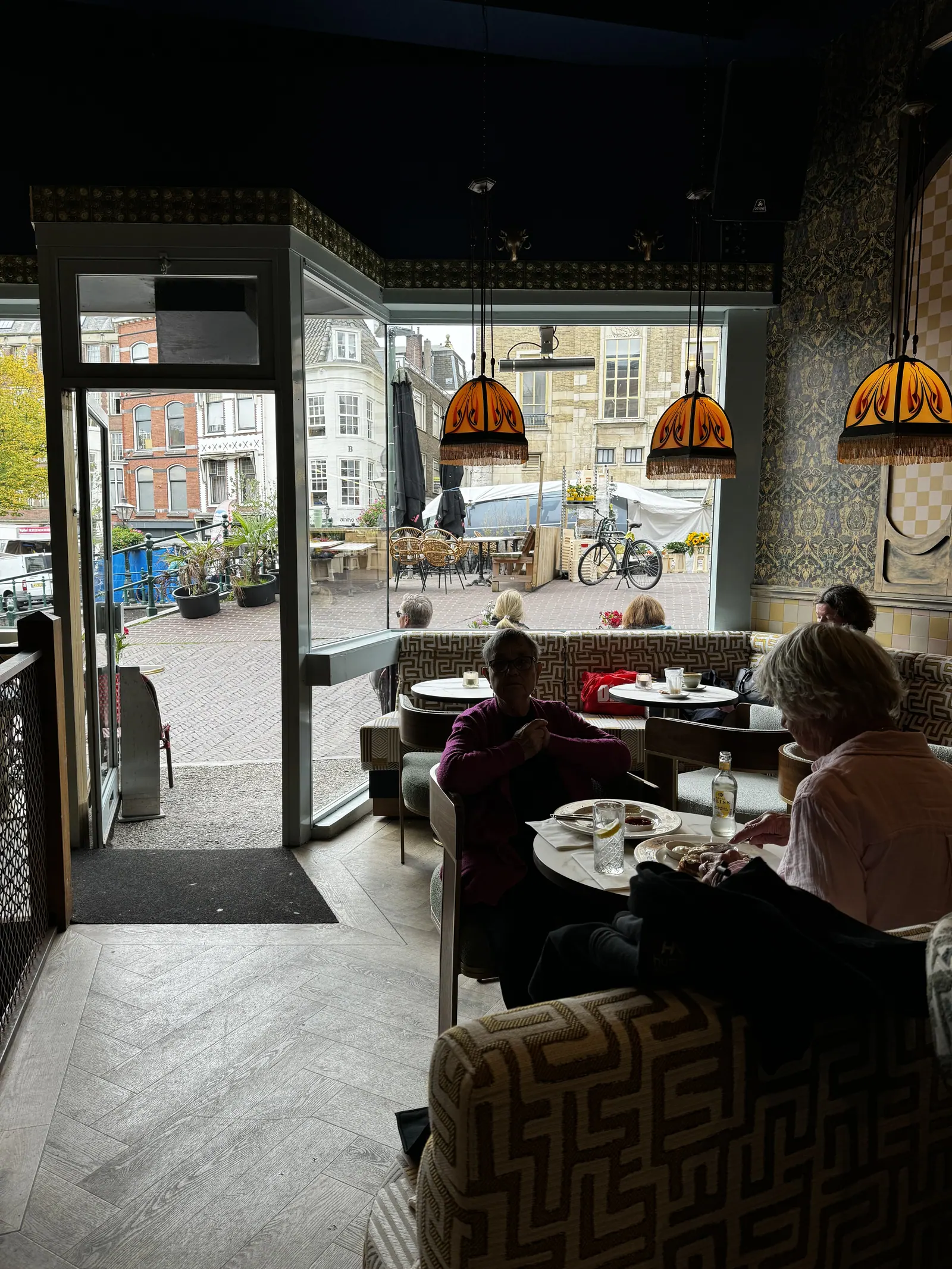 Atmospheric interior of a Leiden grand café with warm lamps