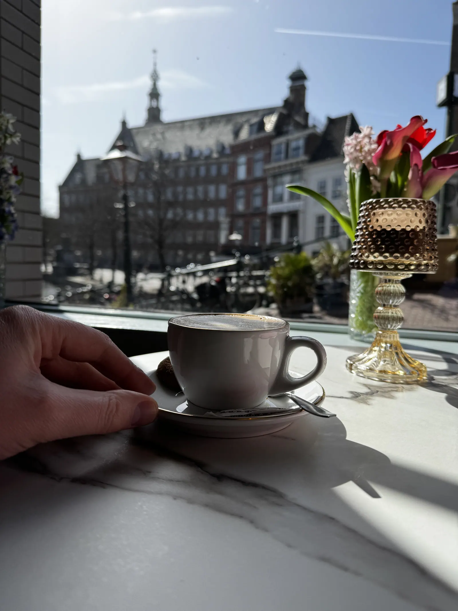 Cup of coffee with a view over a Leiden canal
