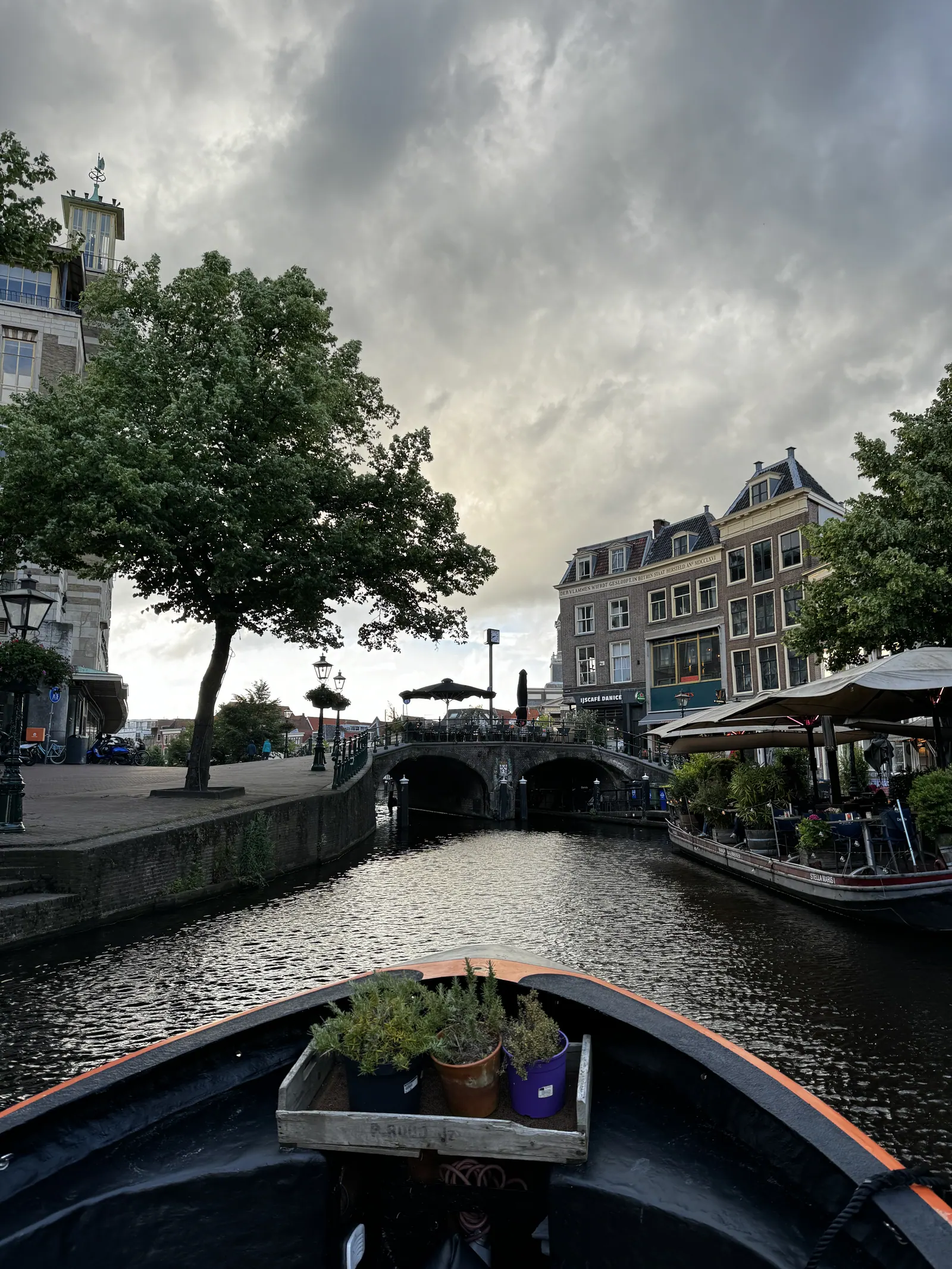 Small boats and canal cruises on a Leiden canal in evening light