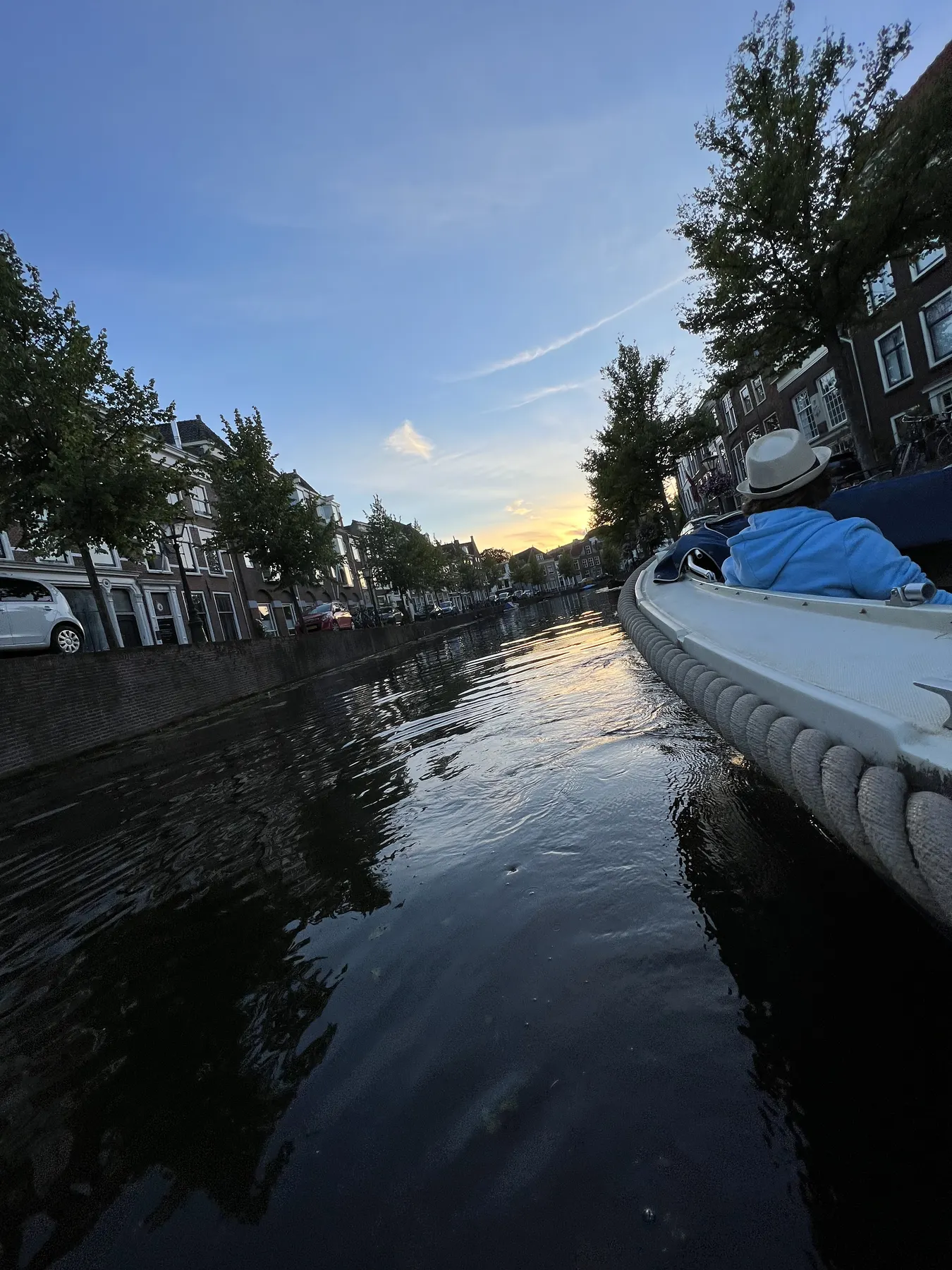 Open boat on a Leiden canal at sunset Open boat on a Leiden canal at sunset